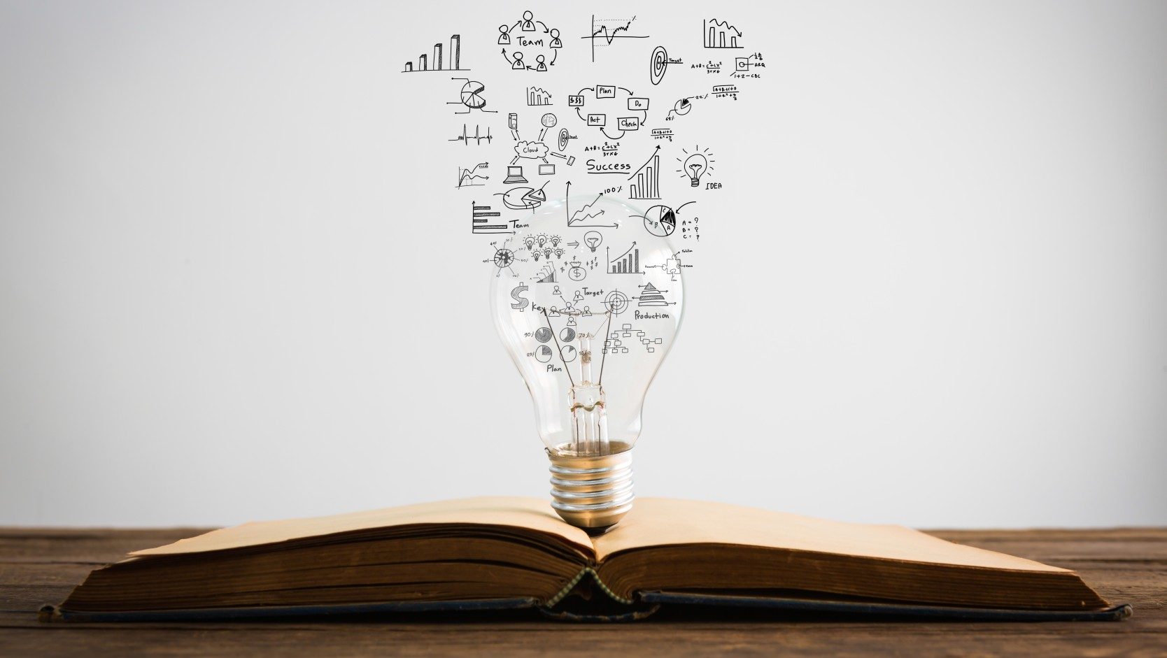 Book with light bulb on it