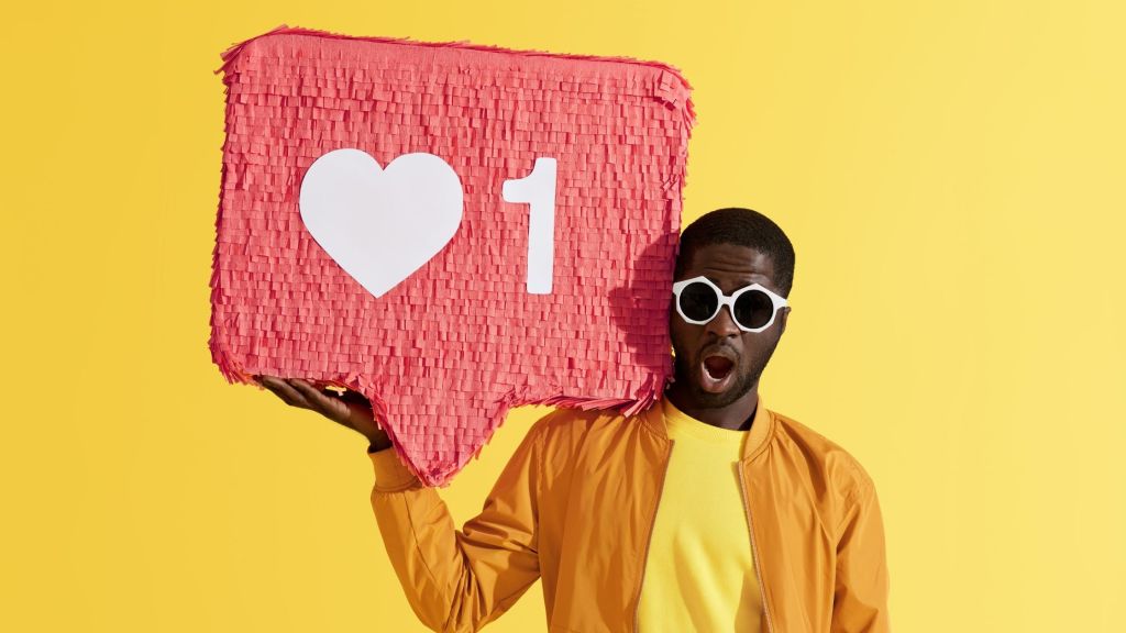 Guy holding a like notification